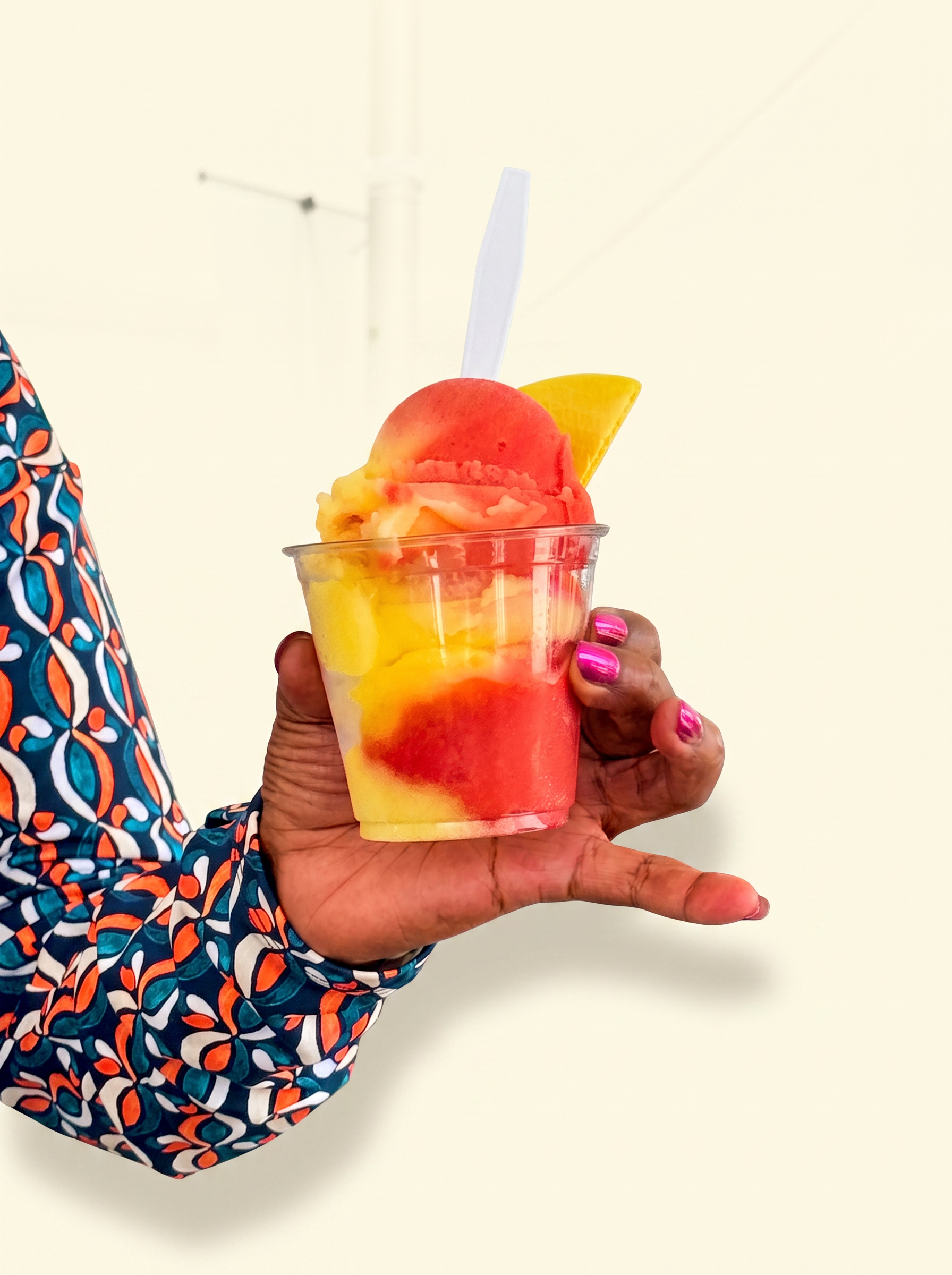 Strawberry lemonade Italian ice in a 9 oz cup