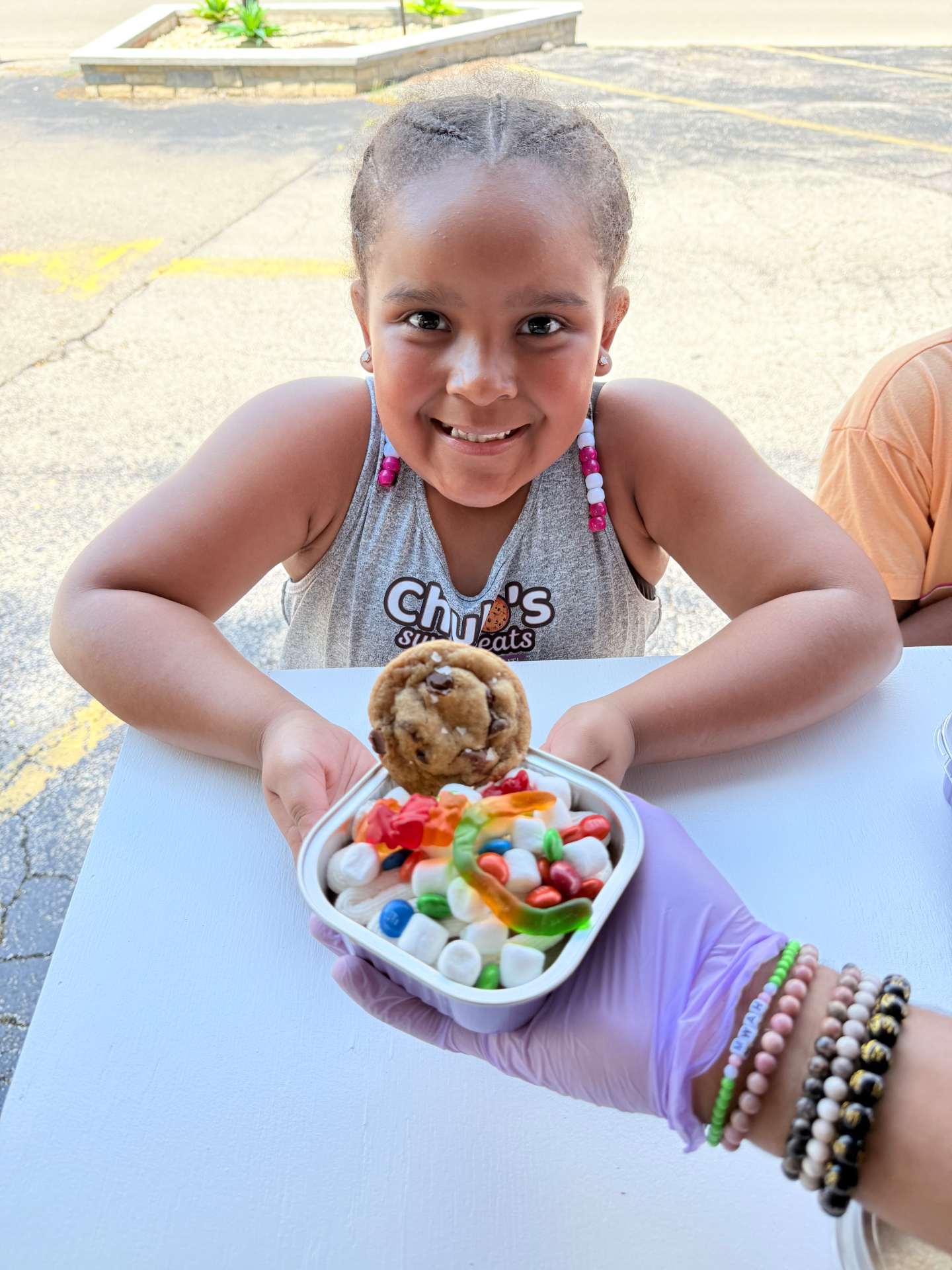 Javian's daughter enjoying her custom cake bar creation